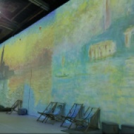 Monet art on wall with deckchairs