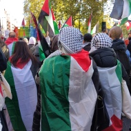 Women wearing Palestine flags on their backs